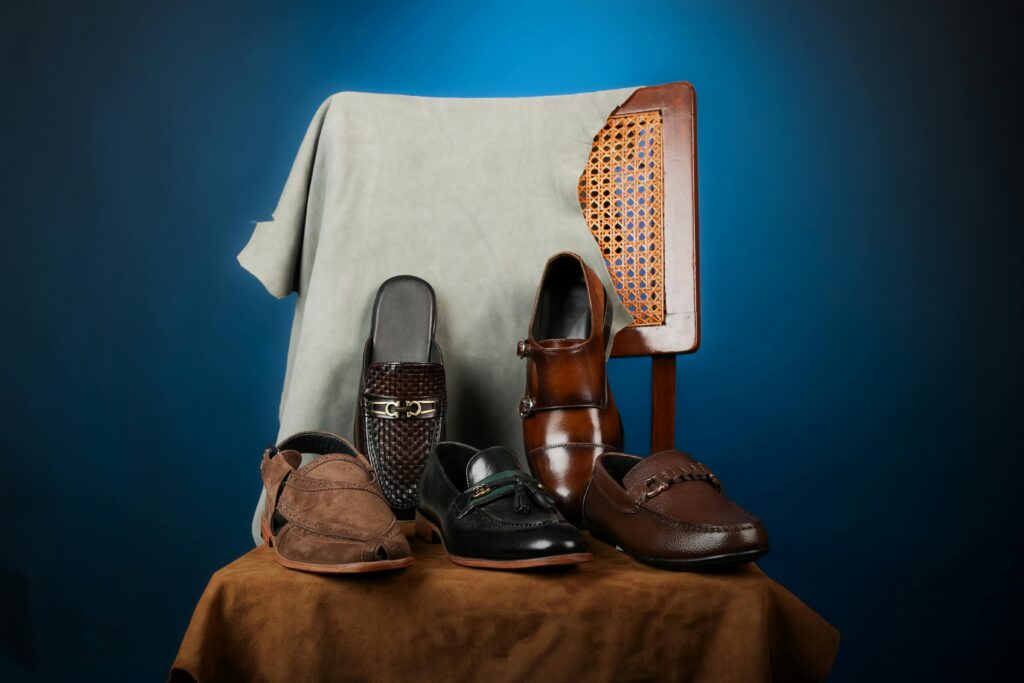 A pair of classic Chelsea boots and loafers placed side by side, showing versatile footwear options for all seasons.
